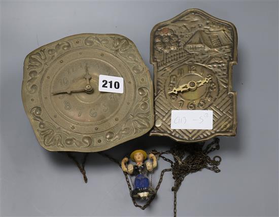 Two brass wall clocks